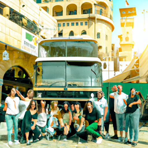 A group photo of happy tourists, with the iconic Bein Harim tour bus in the background